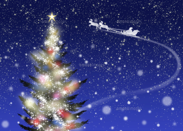 色々な色に光るクリスマスツリーとソリに乗ったサンタクロース