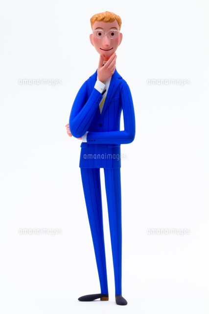 アゴに手をあてて立つ丸いメガネのビジネスマン の写真素材 イラスト素材 アマナイメージズ