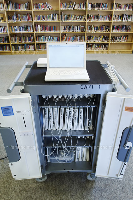 Cart of Laptops in Front ofBookshelves in School Library[20025262161]の ...