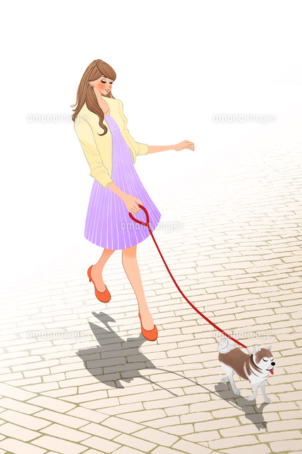 犬の散歩をする女性 の写真素材 イラスト素材 アマナイメージズ