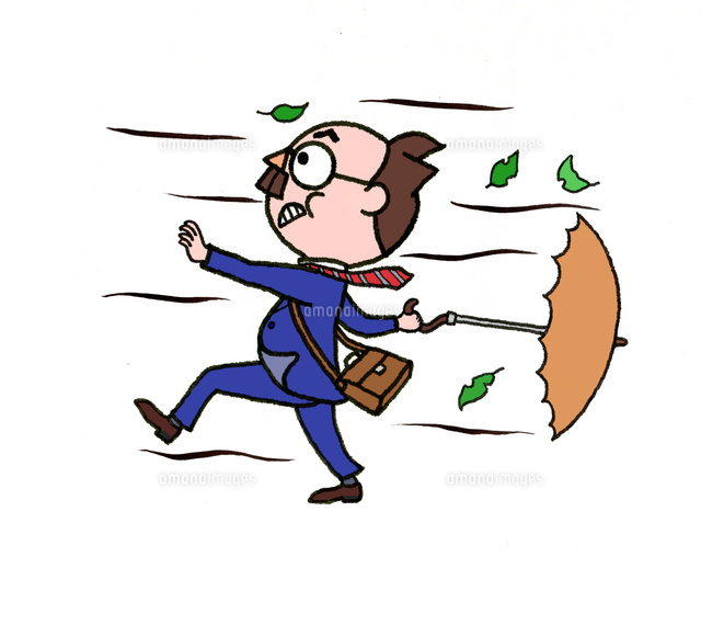 向かい風にも負けず進む中年男性 の写真素材 イラスト素材 アマナイメージズ