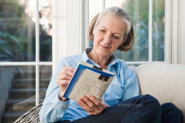 Senior Woman Doing Sudoku Puzzles 11015206048 