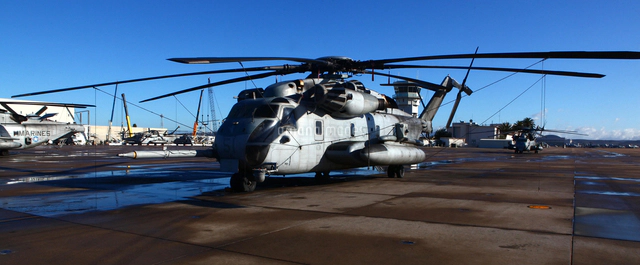 A CH-46 Sea Knight helicopter lands on the deck of the USS P