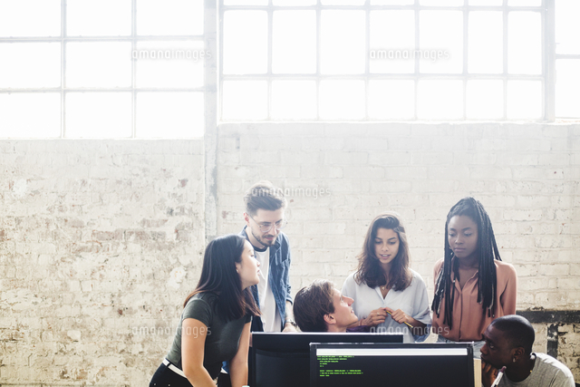 Professional programmers working in team while coding at creative ...