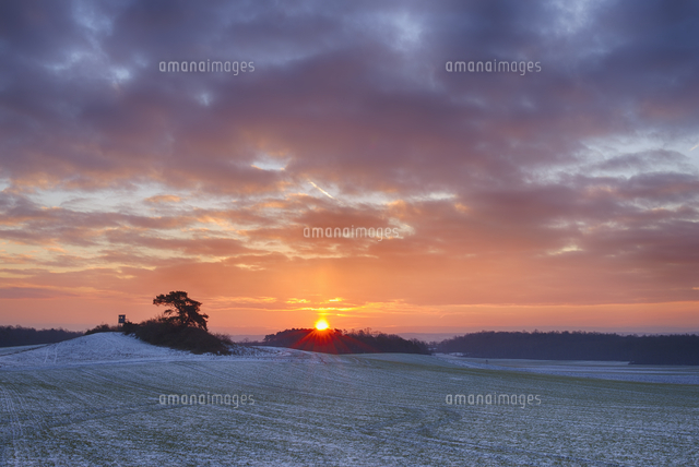 Germany, Bavaria, Sunrise over rural landscape with fields a ...