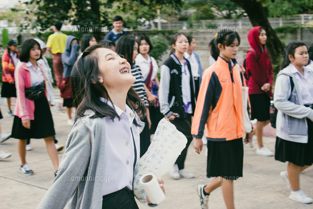 Woman Laughing While Walking With Friends On Footpath In City ...