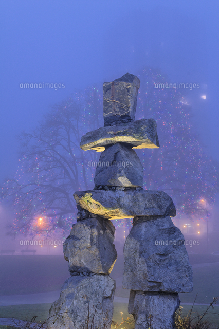 Inukshuk, English Bay, with fog and Christmas lights at Beach Avenue ...